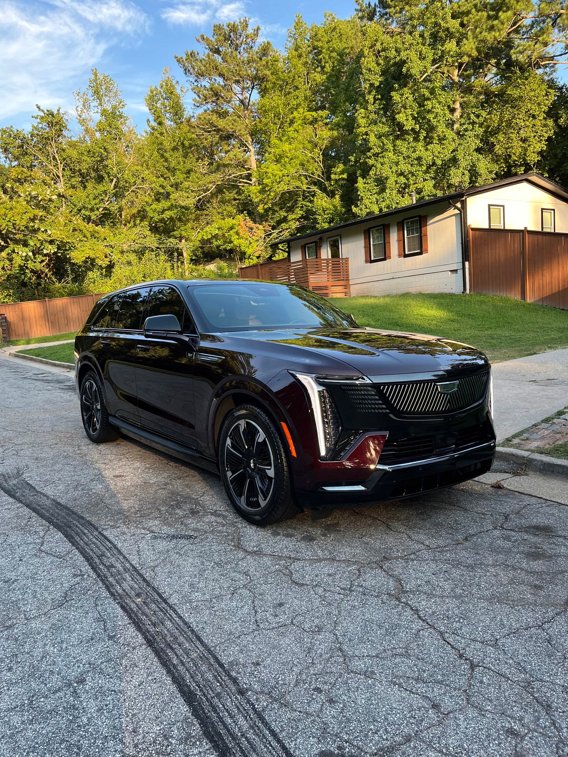 Black Cadillac Escalade freshly detailed in an Atlanta driveway